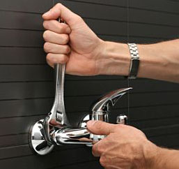 Mike installs a new bathroom faucet, part of our Lewisville plumbing fixtures and appliances repair
