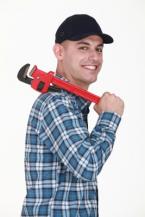 Lewisville TX plumbing contractor with a pipe wrench